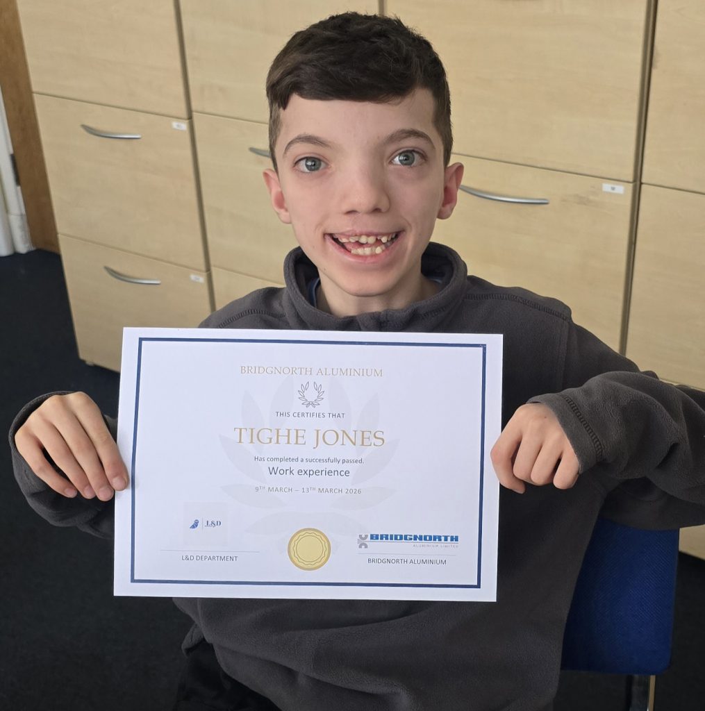 Tighe Jones showing off his work experience certificate.