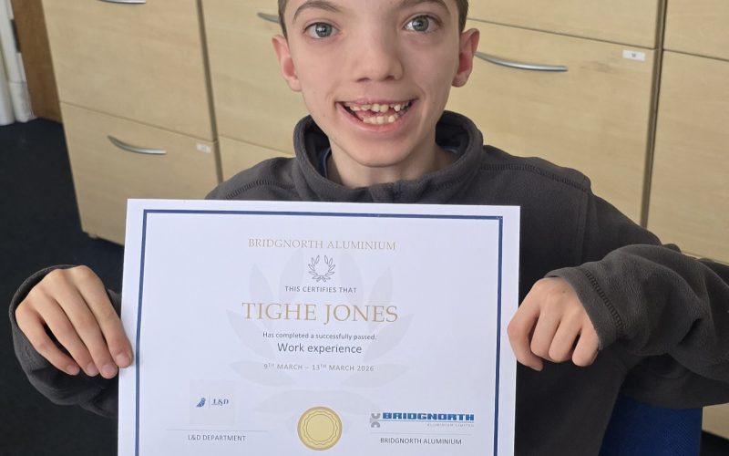 Tighe Jones showing off his work experience certificate.